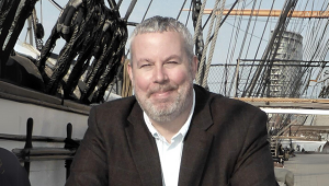 a man in his 50s on a boat